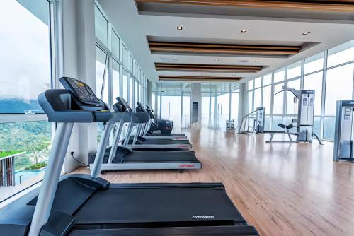 a gym with treadmills and elliptical machines at Windmill Upon Hills Genting Highland in Genting Highlands