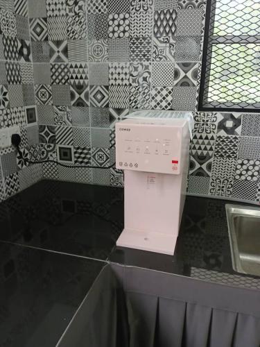 a white box sitting on top of a counter at Teratak Falah Homestay in Sungai Buluh