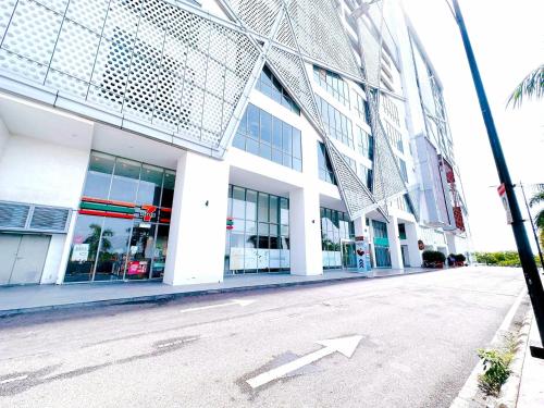 an empty street in front of a building with an arrow at Silverscape Seaview Residence Melaka in Melaka
