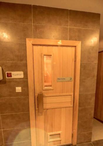 a shower with a glass door in a bathroom at Silverscape Seaview Residence Melaka in Melaka