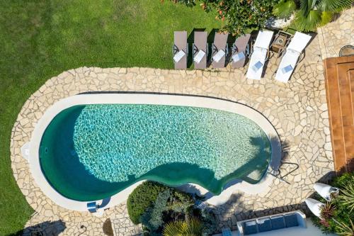 an overhead view of a swimming pool in a yard at Villa Magnolia Umag in Umag