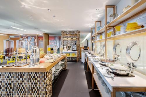 a store with counters with dishes on display at MU Hotel in Ipoh