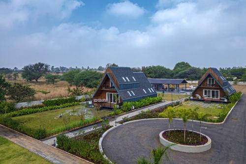 an aerial view of a house with a yard at Palasa by Aer Studio in Nashik