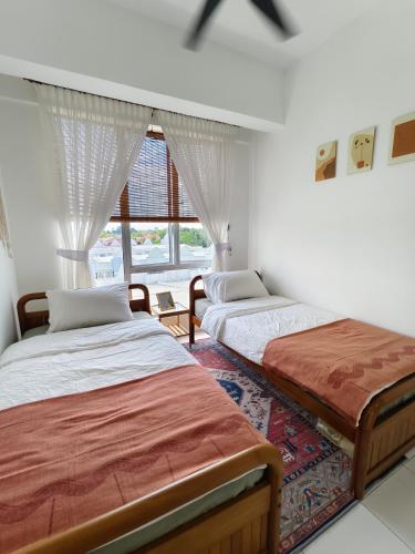 Ένα ή περισσότερα κρεβάτια σε δωμάτιο στο ILHAM SURI Boho Apartment in Wakaf Che Yeh