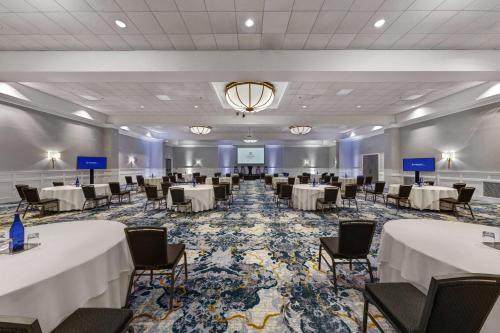 a large banquet room with tables and chairs at Seaview, A Dolce Hotel in Galloway