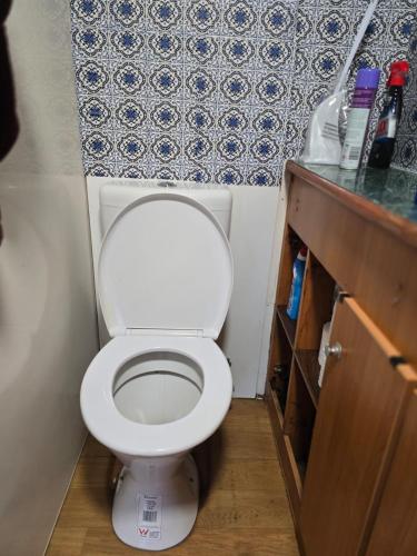 a small bathroom with a white toilet in a room at Caravan at 36 Clarevale in Clayton North