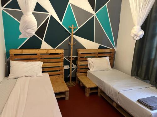 Katil atau katil-katil dalam bilik di Mardai Homestay