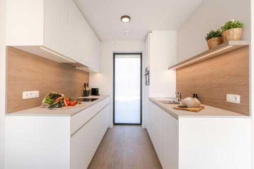 Kuchyň nebo kuchyňský kout v ubytování Maison Ariël