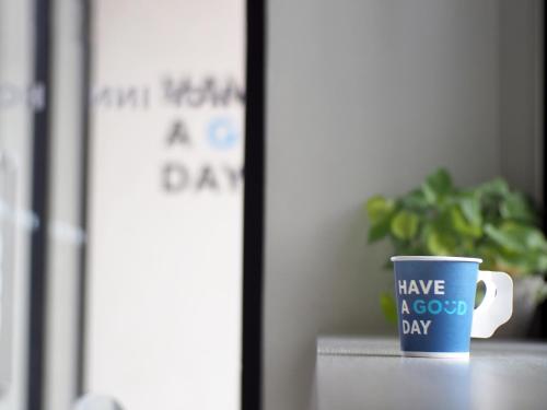 a blue coffee cup with have a good day written on it at HOP INN Krabi Building B in Krabi town