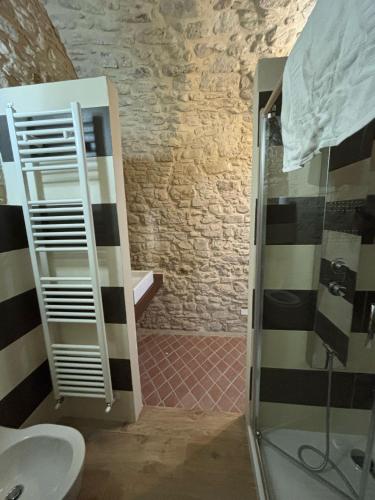 a bathroom with a glass shower and a sink at Castel di Pietra in Pietra Montecorvino