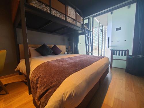Postel nebo postele na pokoji v ubytování Spa & Hotel Suishun Matsuiyamate