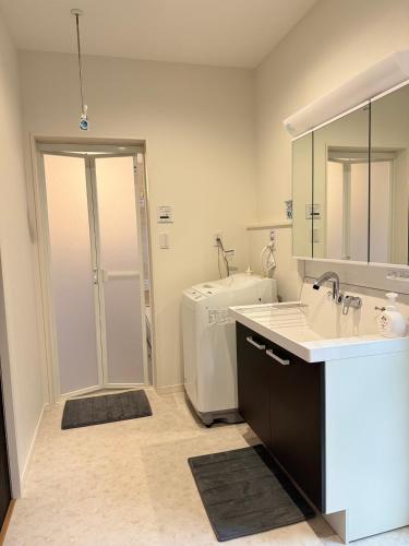 a bathroom with a sink and a toilet at Akikawa Waifu 1 in Kikuchi