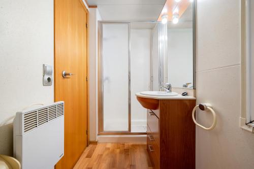 a bathroom with a sink and a mirror at La Marquesa in Camarles