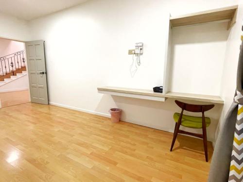 a room with a desk and a chair in a room at ALEXIS VILLA Whole OR Room in Muar