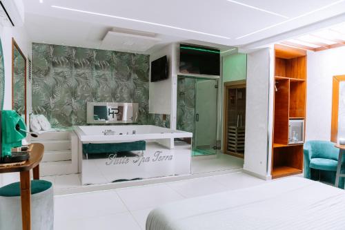 a bathroom with a sink and a microwave at Hotel Paradiso in Lago Patria