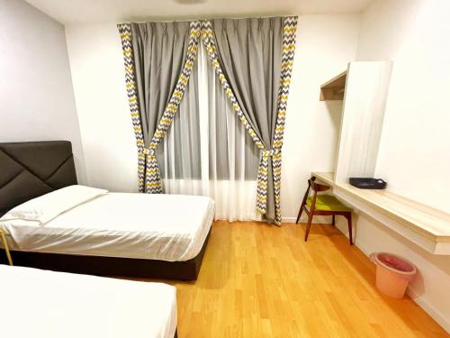 a small room with two beds and a window at ALEXIS VILLA Whole OR Room in Muar