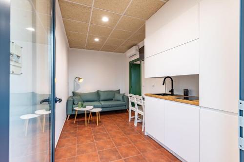 Η κουζίνα ή μικρή κουζίνα στο Apartamentos BICO DE NONA