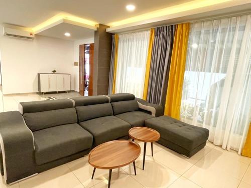 a living room with a couch and a table at ALEXIS VILLA Whole OR Room in Muar