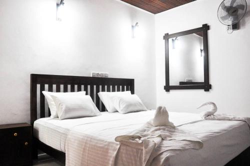 Postel nebo postele na pokoji v ubytování Better Yala Home