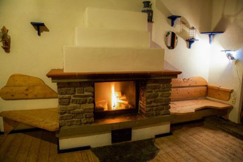a fireplace in a room with a cake at Villa Emilia in Kals am Großglockner