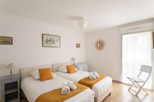 Voodi või voodid majutusasutuse La Cabine du Val - A proximité de la Plage toas