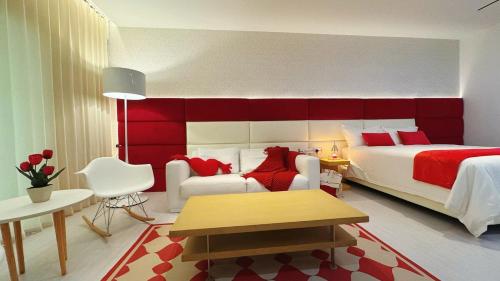 a bedroom with a large bed and a red headboard at Subang Jaya Armani Soho in Subang Jaya