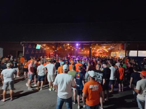 a large crowd of people standing in front of a stage at Campingplatz Orange Schindelbacherhof in Spielberg