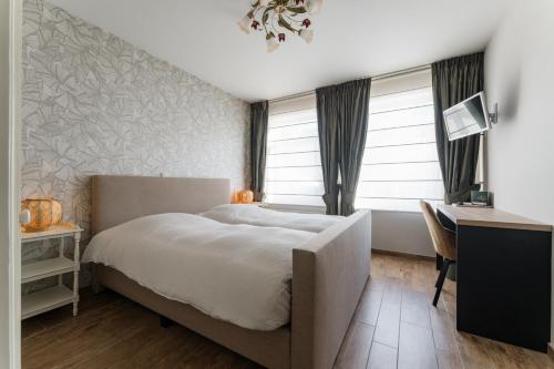 Postel nebo postele na pokoji v ubytování B&B De Floreffe