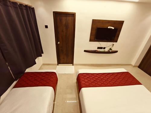 Katil atau katil-katil dalam bilik di Woodlands Inn