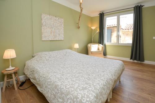Postel nebo postele na pokoji v ubytování Maison Le Petit Balcon Beaucaire