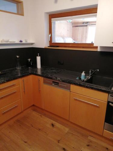 a kitchen with a sink and a counter top at Ferienwohnung in Schwarzach