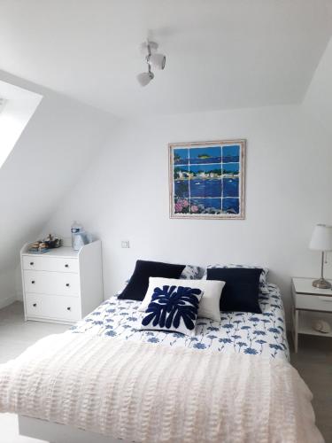 Ένα ή περισσότερα κρεβάτια σε δωμάτιο στο Chambre d'hôtes avec petit-déjeuner