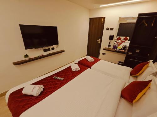 Katil atau katil-katil dalam bilik di Woodlands Inn