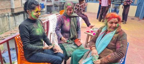 a group of three women with paint on their faces at The Heritage jasmine lodge B&B in Shimla