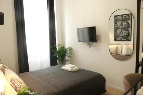 TV a/nebo společenská místnost v ubytování Giulio Cesare Comfort Rooms