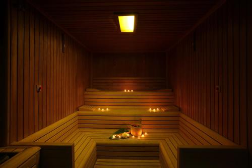 a sauna with stairs and lights in a room at Kuum Hotel & Spa in Golturkbuku