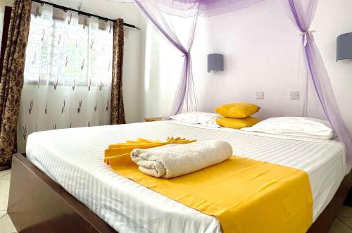 Ένα ή περισσότερα κρεβάτια σε δωμάτιο στο Papillon Garden Bar Villas
