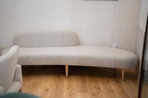 a chair sitting in a corner of a room at Casa da Fonte de Cima in Celorico de Basto