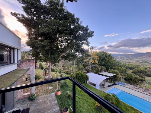 a balcony of a house with a view of a pool at Lujosa finca en La Cumbre, Piscina, jacuzzi, WiFi, 5BR in La Cumbre