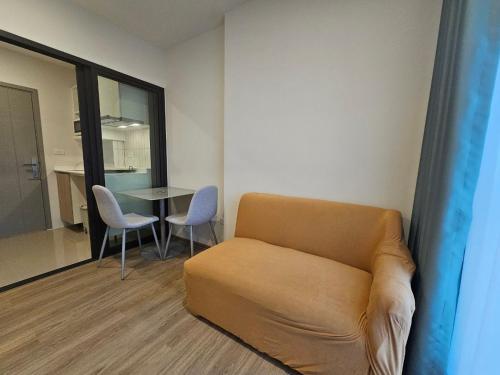 a living room with a couch and a table at Monthly Stay at Escent Trang near Robinson mall in Ban Khuan Khan