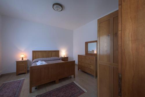 Postel nebo postele na pokoji v ubytování Albergo Diffuso Forgaria Monte Prat