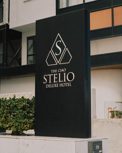 a sign for the club stella deluxe hotel at The Ciao Stelio Deluxe Boutique Hotel - Adults Only in Larnaka