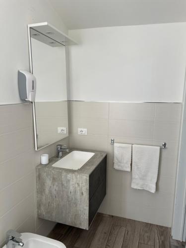 a bathroom with a sink and a mirror at Al Lago da Lilly in Gargnano