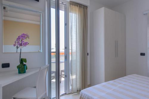Postel nebo postele na pokoji v ubytování Hotel Sans Souci