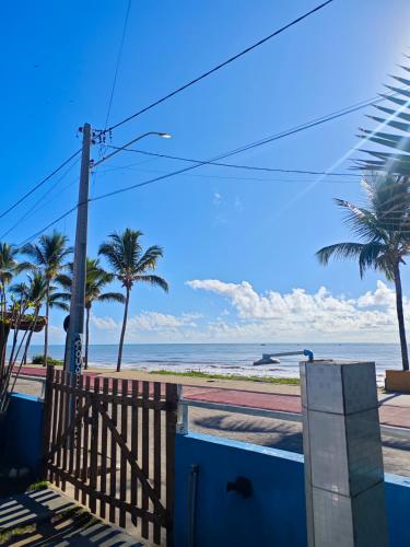 a view of the beach from the balcony of a house at Pousada do Deck in Alcobaça
