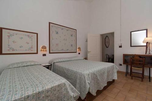 Ένα ή περισσότερα κρεβάτια σε δωμάτιο στο Masseria Barnabei Colonnella