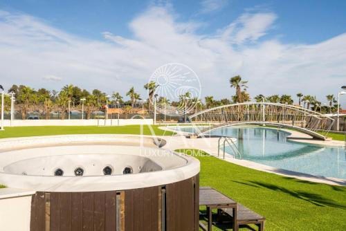 a resort with a water park and a ferris wheel at Casa Mariposa Ivan Luxury Homes 3ªPlta Norte 1ªLínea in Oropesa del Mar