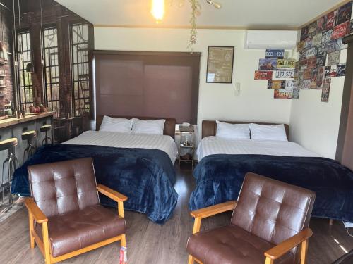 Ένα ή περισσότερα κρεβάτια σε δωμάτιο στο Yokkaichi Guest House