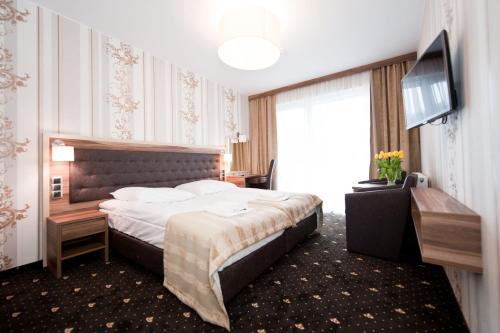 Postel nebo postele na pokoji v ubytování Cristal SPA