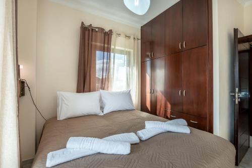 Ένα ή περισσότερα κρεβάτια σε δωμάτιο στο Sunlit sea view apartments